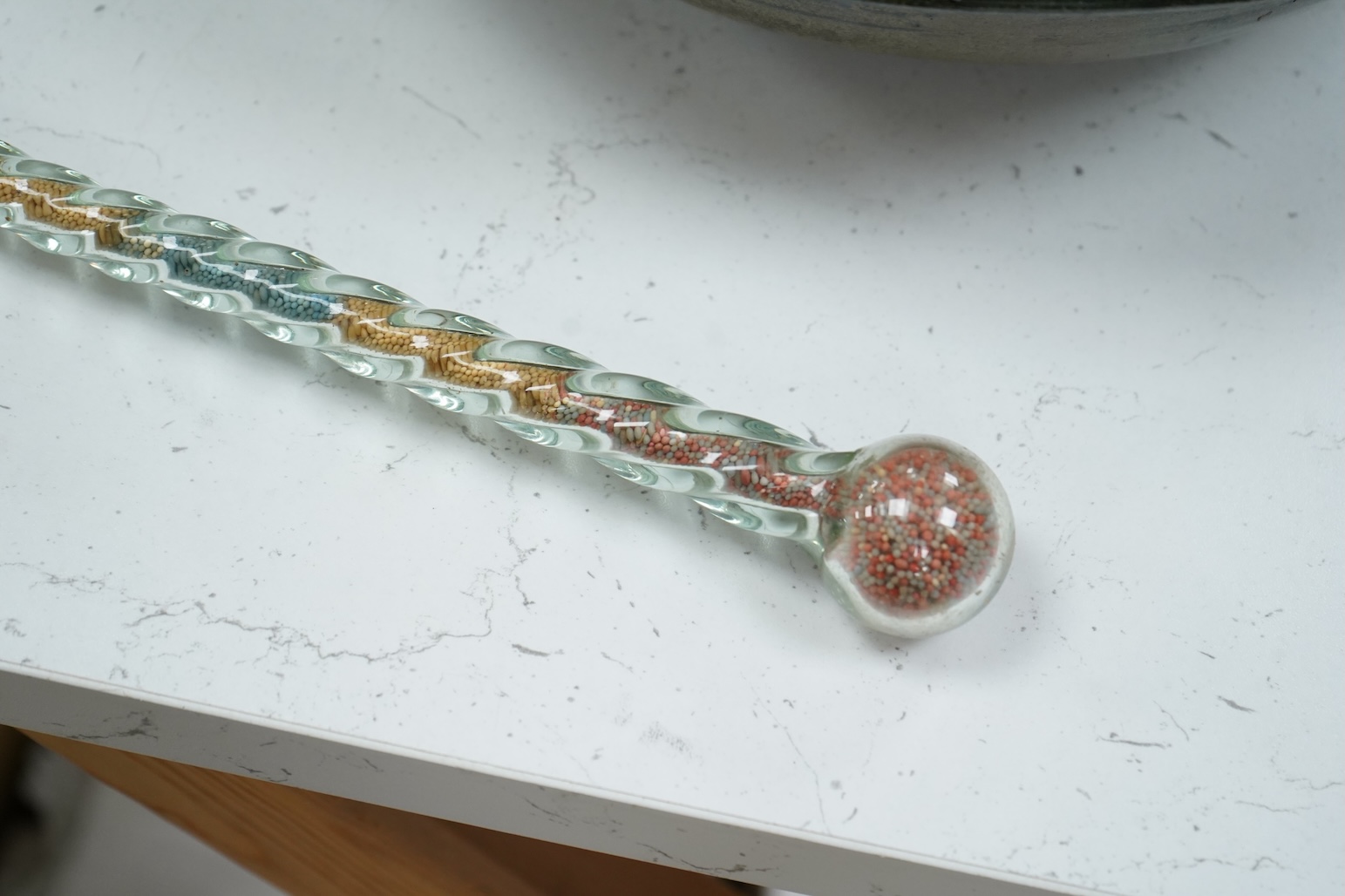A 19th century Nailsea spiral walking stick, decorated with fine coloured beads, 128cm in length